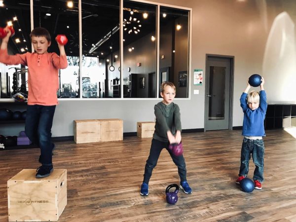 Joshua Steckler enjoys when his sons, Tristan, Preston and Dawson, hang out with him at his gym, Push Fitness in Schaumburg.