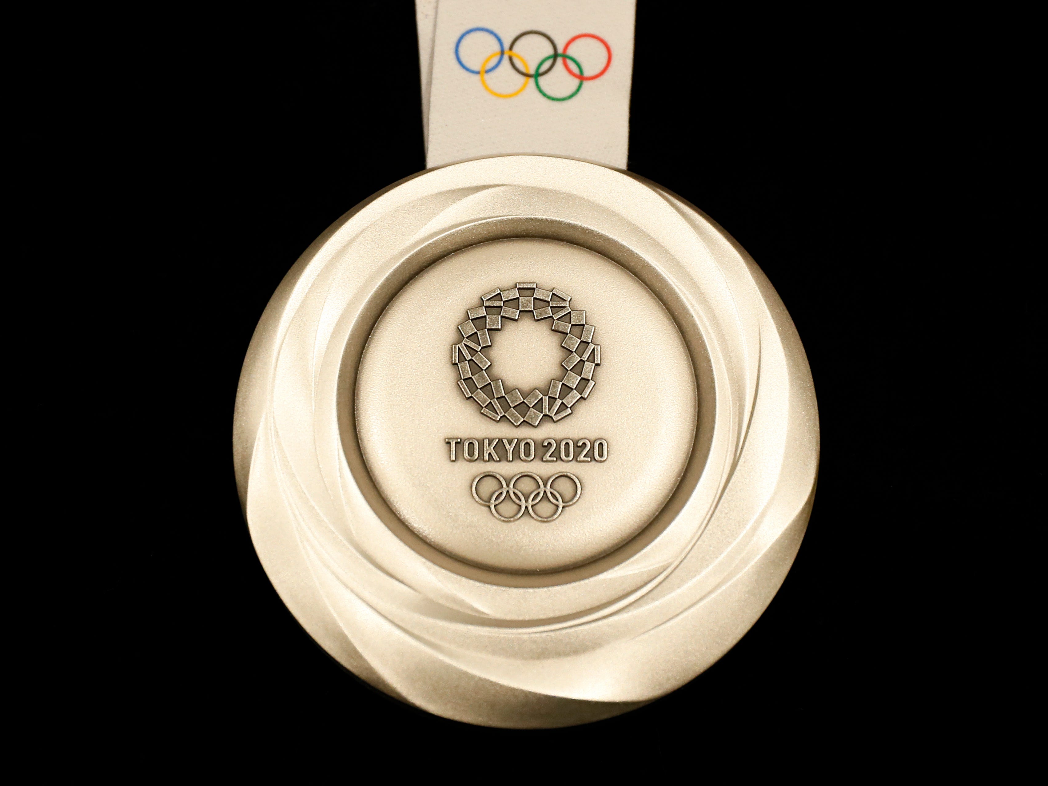 Another view of the silver medal for the 2020 Summer Olympics.