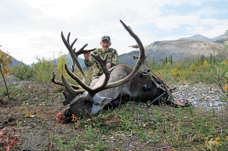 Tom Edgington with mountain caribou