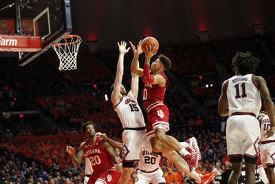 Sophomore guard Rob Phinisee goes up for a basket against Illinois sophomore forward Giorgi Bezhanishvili. Phinisee scored 10 points in the 67-66 loss to Illinois on March 1 at State Farm Center. 