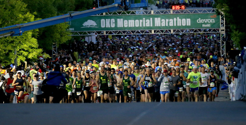 Photo - A second wave of runners start the Oklahoma City Memorial Marathon in Oklahoma City, Sunday, April 28, 2019. [Sarah Phipps/The Oklahoman]