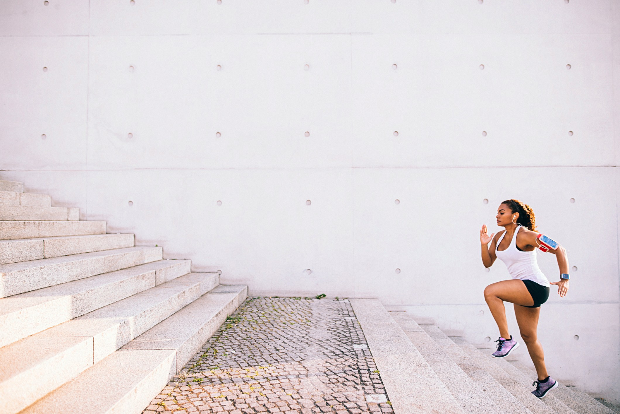 Woman running up stairs