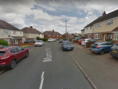 Woman stabbed in neck as gang of men raid Stourbridge home