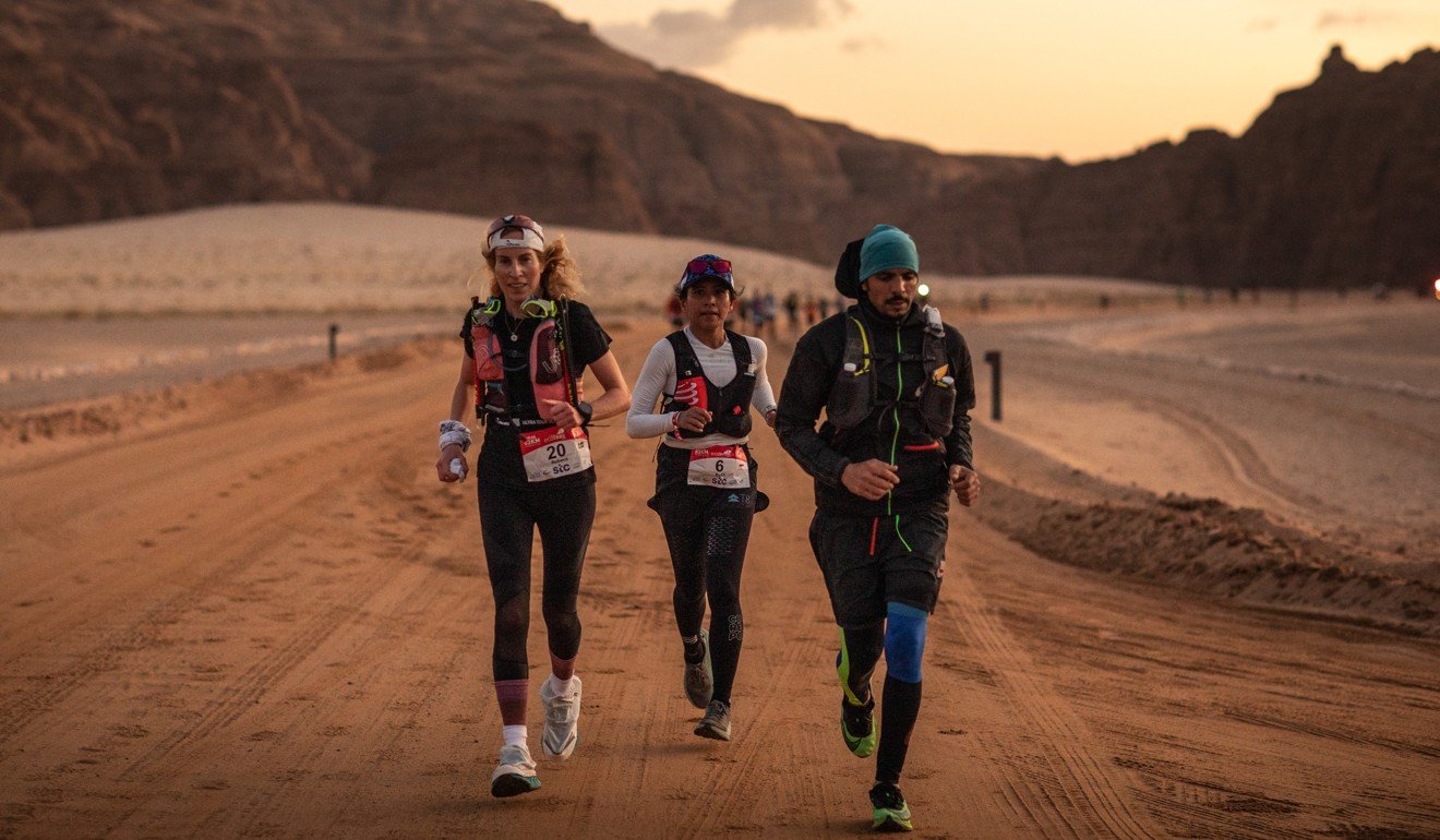 Ruth Teresia, from Indonesia (centre), en route to coming second in the 83km race. Photo: Alexis Berg