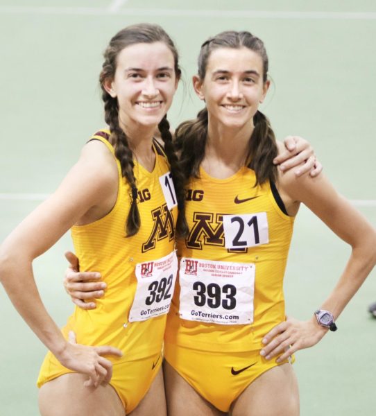 Alexandria’s Bethany (left) and Megan Hasz are all smiles after both ran indoor 5K personal records in Boston this past December. (Photo provided by Gopher Athletics)