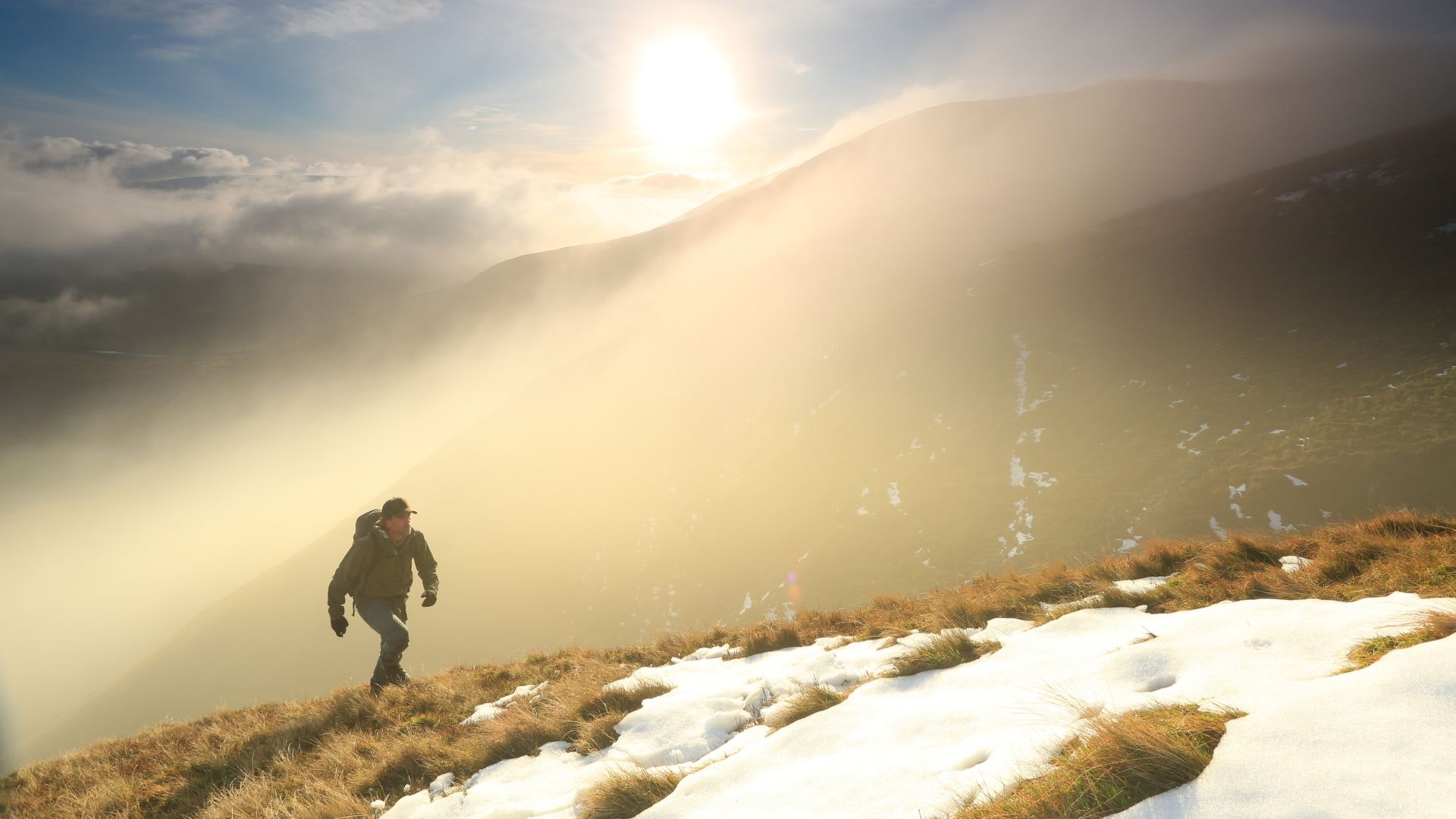 Hiker walking up Cautley Spout in winter