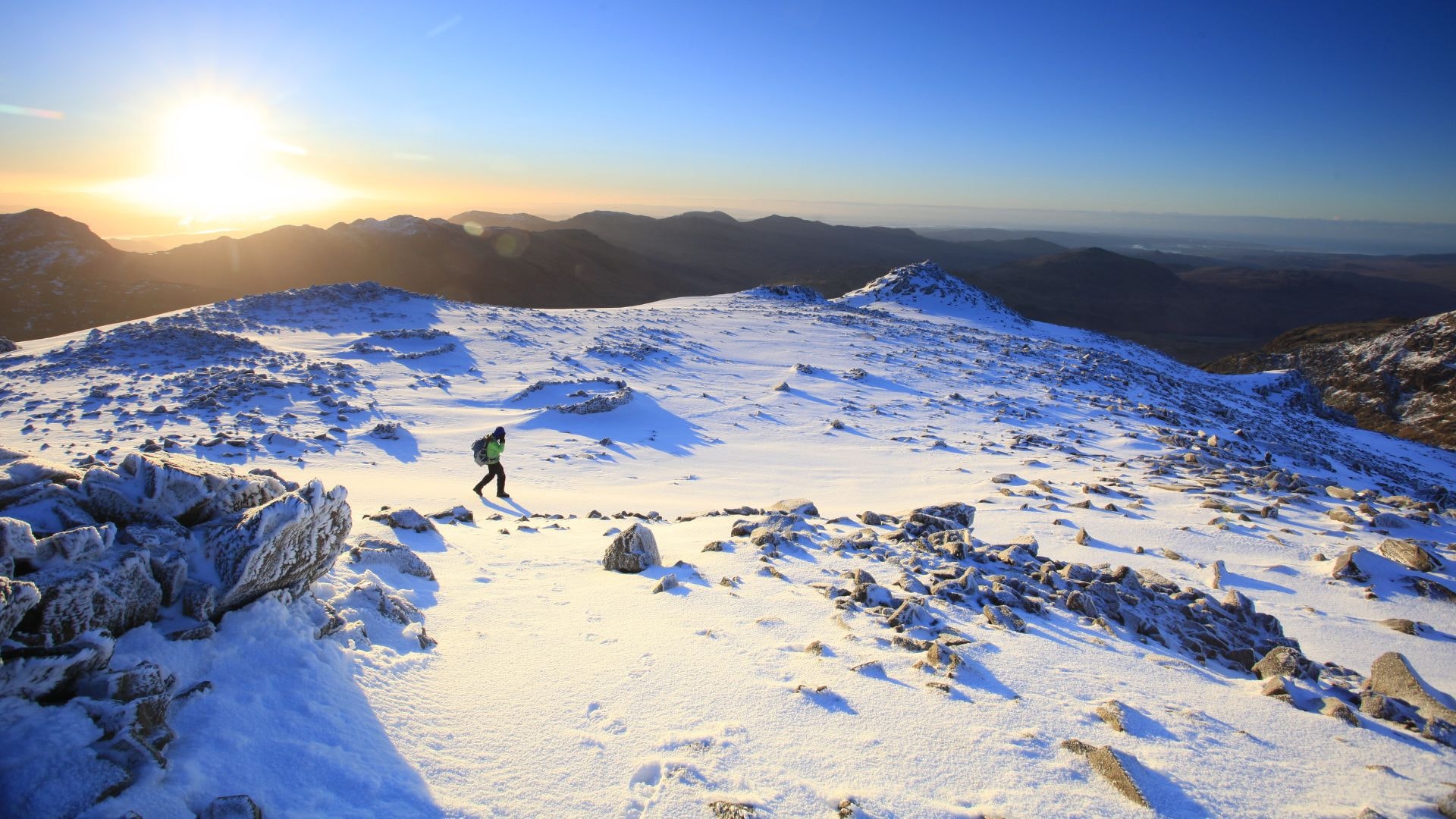 Hiker in early morning on Scafell Pike