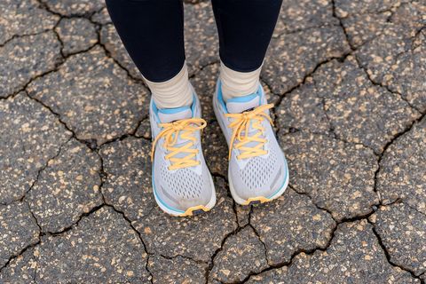 a woman wearing altra via olympus shoes