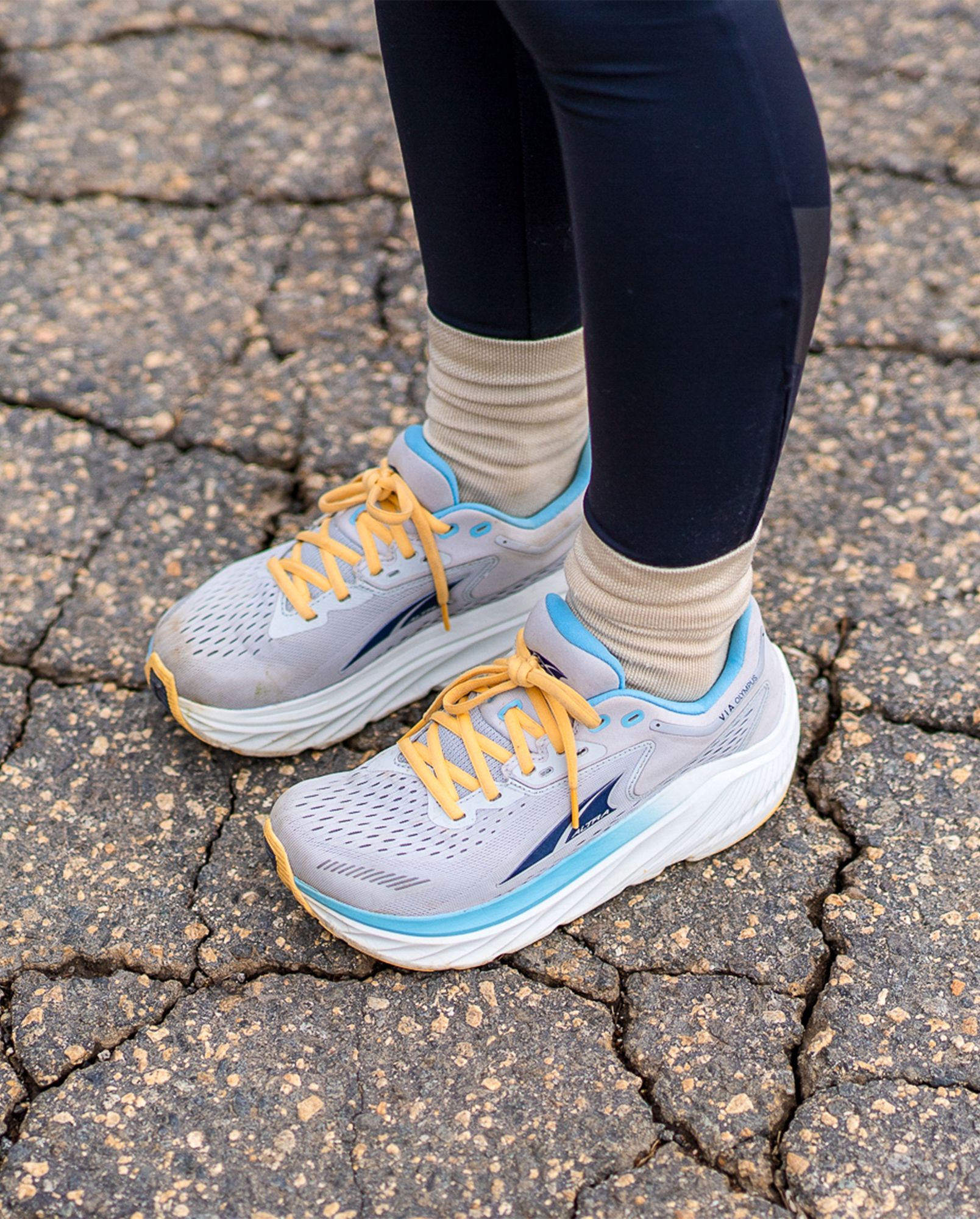 a woman wearing altra via olympus shoes