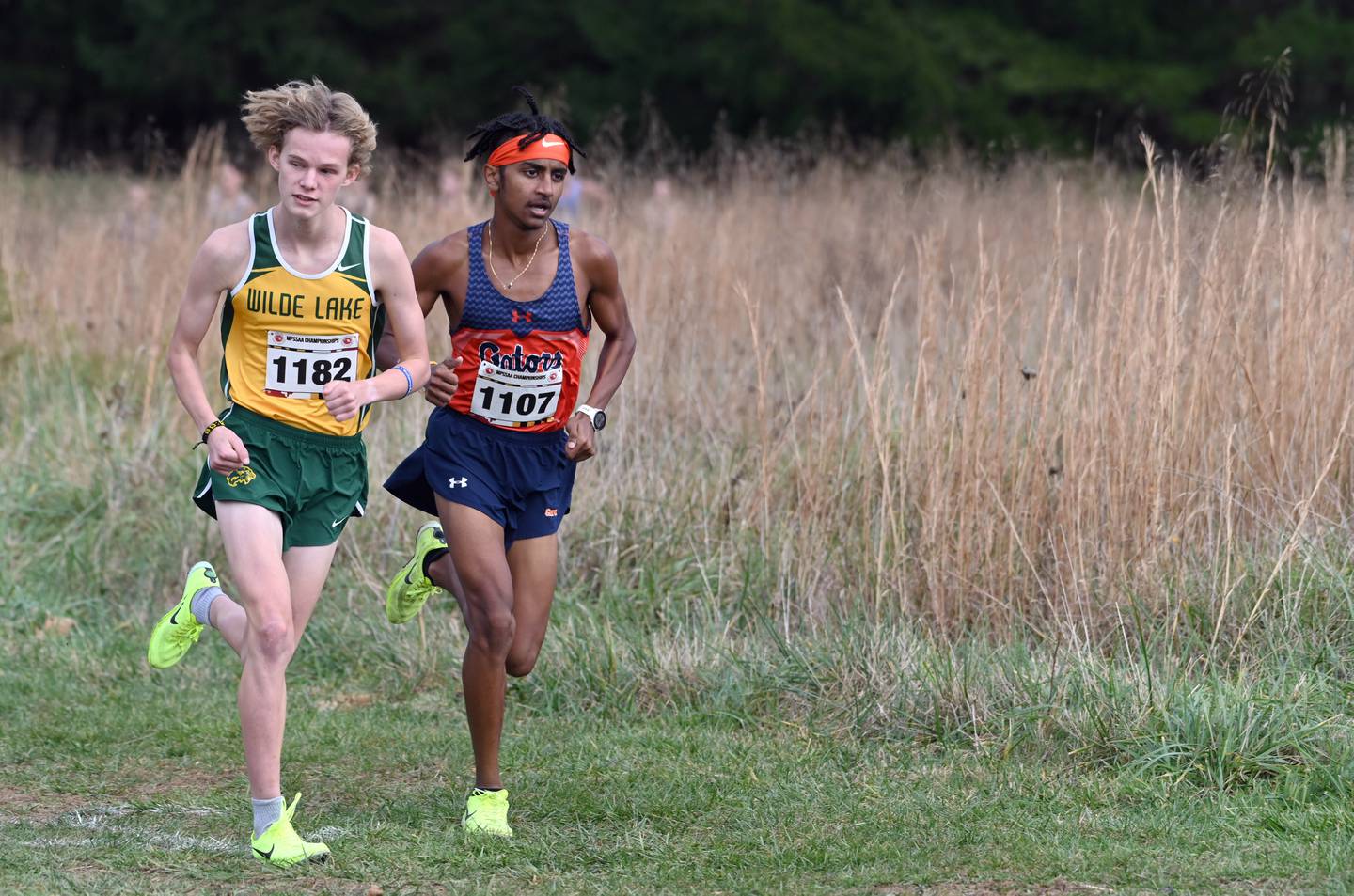 Wilde Lake's Henry Hopper and Reservoir's Kidus Zeleke run side-by-side in the Class 3A boys race during the cross country state championships on Nov. 12. Both are first team All-Howard County selections. 