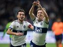 Vancouver Whitecaps Ryan Gauld (right) and Russell Teibert celebrate Gauld's goal against the Seattle Sounders during their Nov. 7, 2021 Major League Soccer game at B.C. Place Stadium.