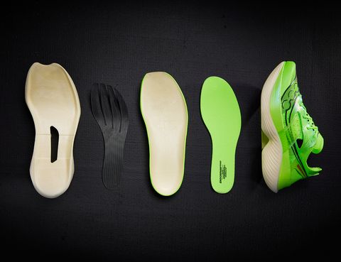 a flat lay of multiple pieces of the saucony endorphin elite shoe