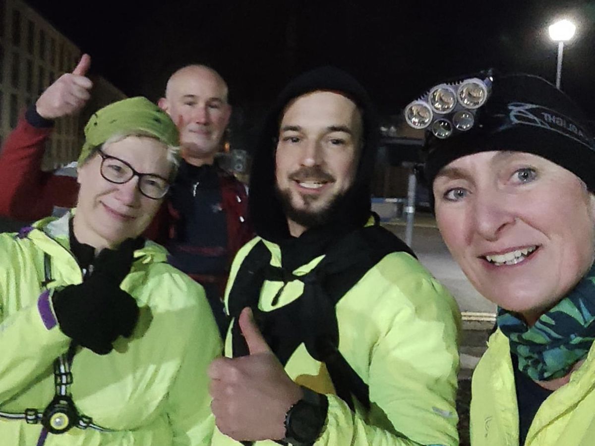 James Morgan pictured (centre) with his brother, Rob Morgan and running friends Wendy Holm and Karen Allen.