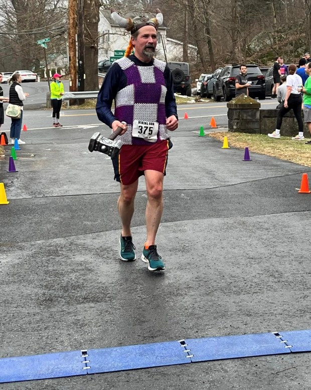 Dan Freedman, of Red Hook, was all dressed up for the Viking Run as he approached the finish line. (Photo Provided)