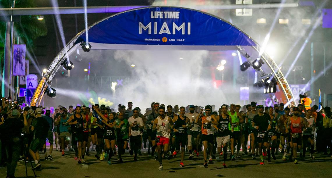 Runners take off from the starting line of the 20th annual Life Time Miami Marathon and Half Marathon in downtown Miami, Florida on Sunday, February 6, 2022. More than 15,000 combined runners participated in the marathon and half marathon.