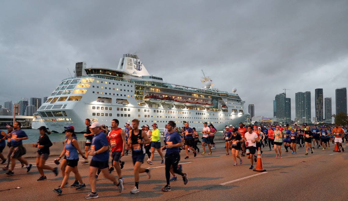 Runners head eastbound on the MacArthur Causeway as the Royal Caribbean cruise ship, Empress of the Seas, enters Government Cut to dock at the Port of Miami. On Sunday, January 27, 2018 thousands of athletes - pushrim, handcycle, and assisted wheelchair, elite, and daily runners participated in the 2019 Fitbit Miami Marathon and Half Marathon. The full course spanned across the Venetian, Rickenbacker, and MacArthur Causeways ending at Bayfront Park in downtown Miami, Florida.