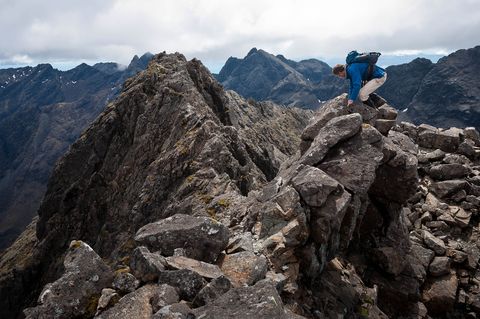 chris hill traversing a knife edge ridge en route to sgurr na banachdaich, a munro on the isle of skye, north west highlands of scotland image © colin henderson photography permission required before use to license this image, please contact me quoting the file reference, size required and your planned end usage