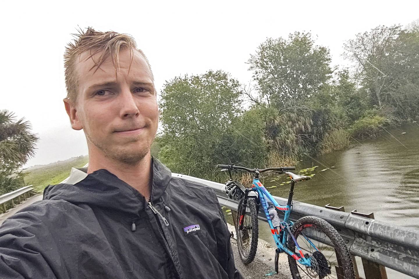 Central Florida Explorer Patrick Connolly takes a selfie with checkpoint seven, a bridge, during an adventure race at Lake Apopka North Shore on Sept. 20, 2020. 