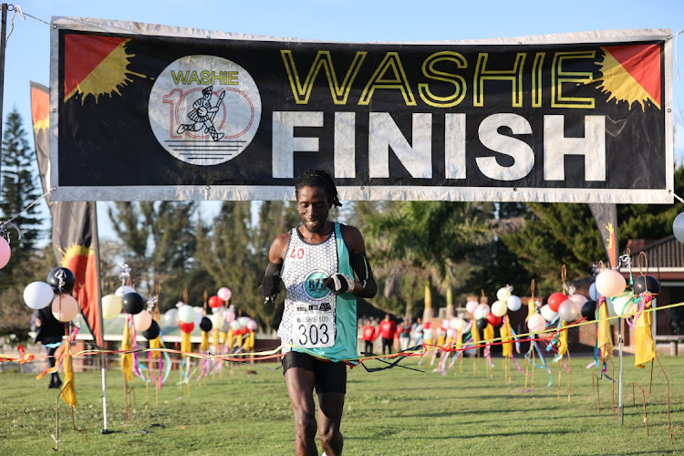 Monwabisi Ntozini from R72 running club in Kidds Beach wins the 2022 Washie 100.