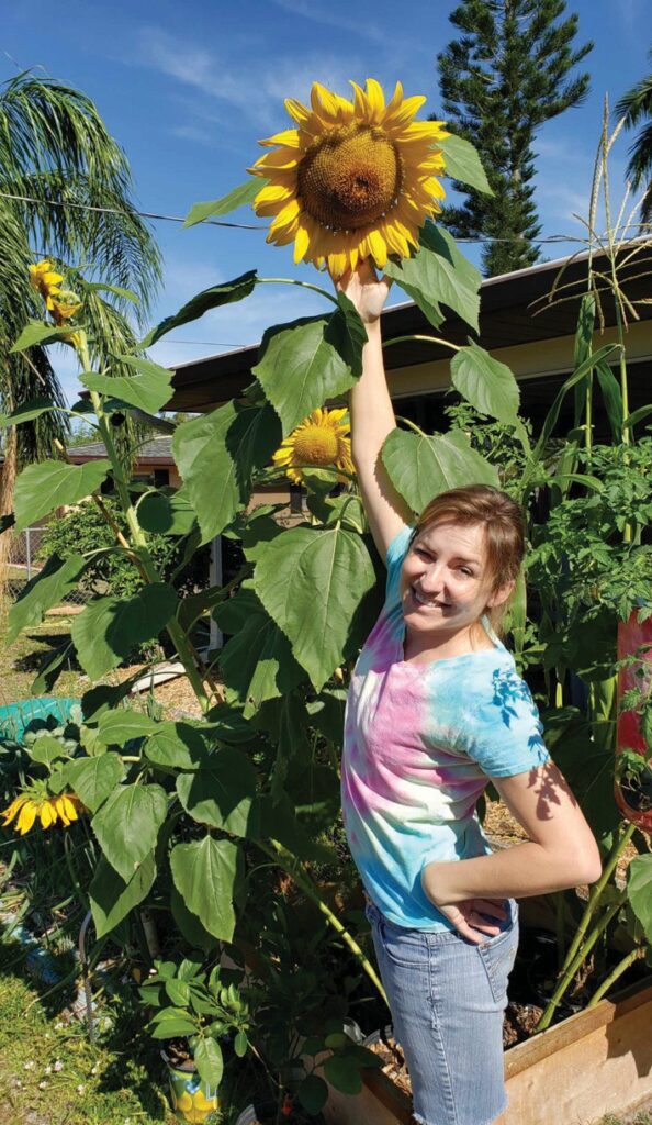 Like her father, John Cassani’s daughter, Sar- ah, has a green and sunflower thumb.