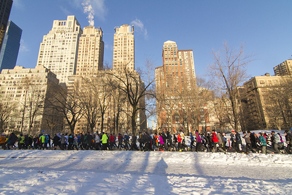 Central Park scene with runners in snow